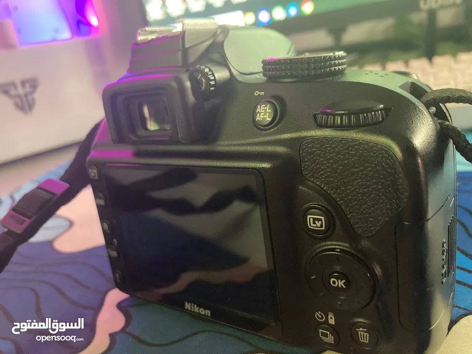 نيكون 3300d حال الوكاله  شتر قليل  عدسه 18/55 ستراب  وصلات  ترايبود  شاحن  بطاريه