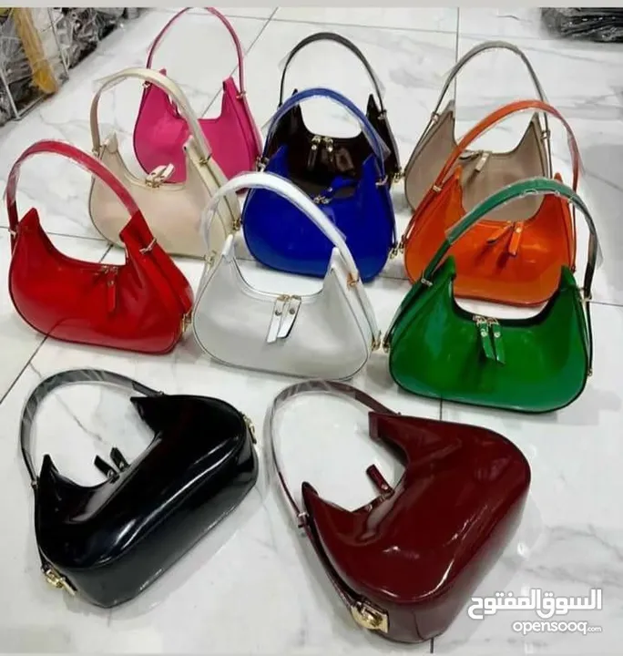 شنتة ستاتي اصلي مع العلبة  جلد طبيعي جودة عالية جدا  سحاب ويد طويلة  مقاس 21×27