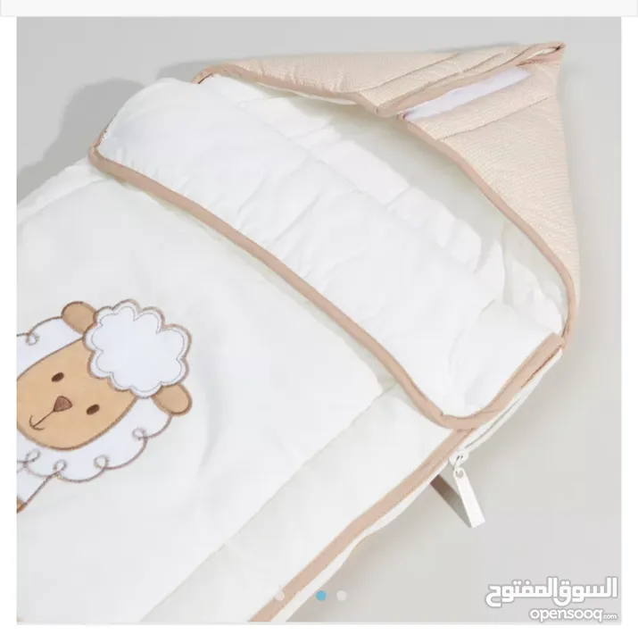 Different baby products (Bedding sets, sleeping bag, changing mat and baby head shaping pillow)