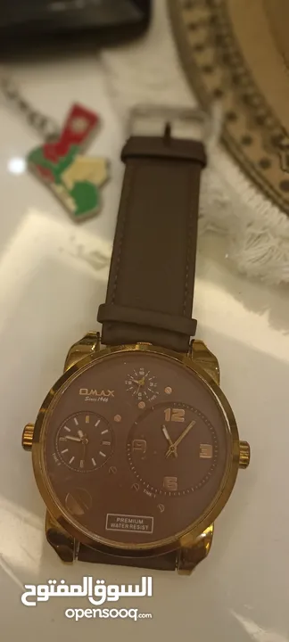 ساعة رجالية فخمة لون ذهبي حجم كبير جدا- OMAX