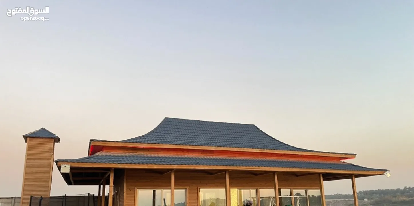 مزرعة على شاطيء دجلة مع بيت مصمم على شكل البيوت الصينية..