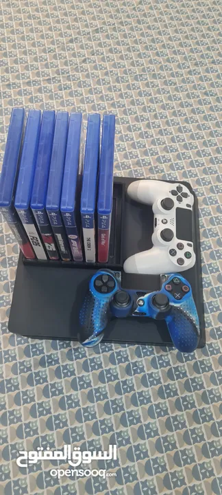 playstation 4 slim 500gb with 2 controllers and 7 games