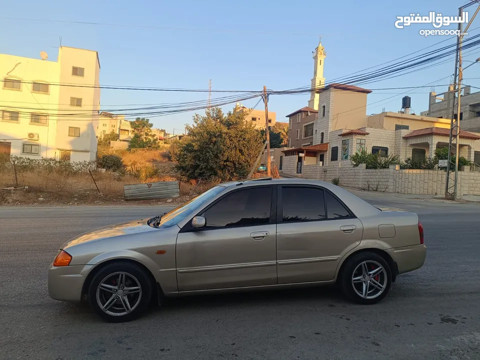 مازدا 323 اتماتك فتحه اصليه تحفه بمعنا الكلمه بسعر حرق 29500 ألف نقدا بدل وارد فحص نخب