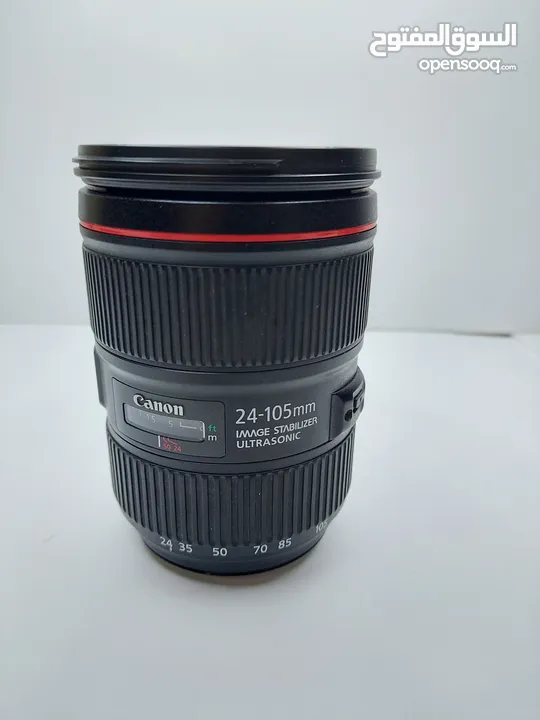 للبيع عدسة 105-24 canon الأصدار الثاني الخط الأحمر، نظيفة جدا+ هود للعدسة مجانا