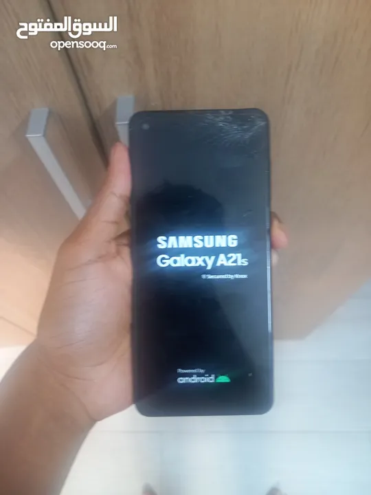 Samsung a21s 64gb (works perfectly only the top right screen is cracked)