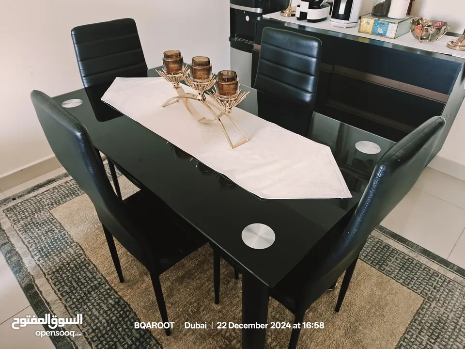 Glass dining table with 4 chairs from danube