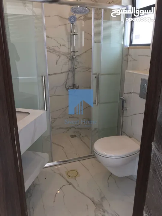 شقة أرضية فاخرة للبيع في الجندويل  - مقابل أسواق السلام 130م مع ترس 30م لم تسكن