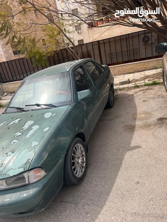 دايو سيلو موديل 1995 لون اخضر  عليها جنط ماتور 16