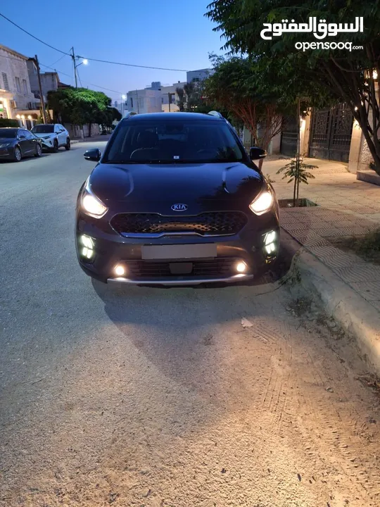 سياره كيا نيرو 2021 لون فيراني كامل الإضافات ما عدا الفتحه للبيع فحص 7 جيد