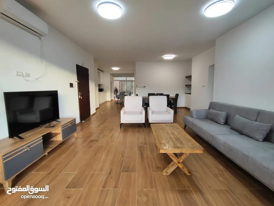 شقة جديدة مفروشة مع حديقة للإيجار – عين منجد  شارع إسكان المهندسين