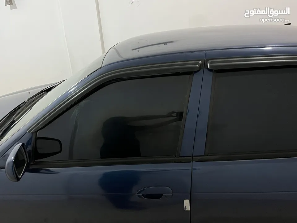 كيا سيفيا لون ازرق ميتالك نظيفه مع جنط 15 مميز كاوشوك وكاله غرفه نطيفه بطاريه جديده لسى كفالتها معها