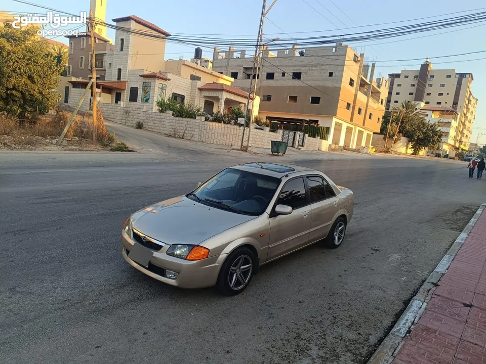 مازدا 323 اتماتك فتحه اصليه تحفه بمعنا الكلمه بسعر حرق 29500 ألف نقدا بدل وارد فحص نخب