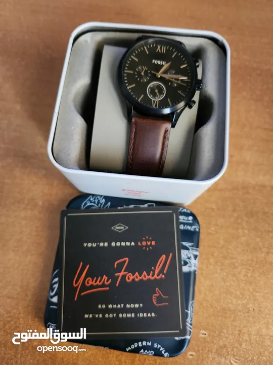 Brown and Black Fossil watch