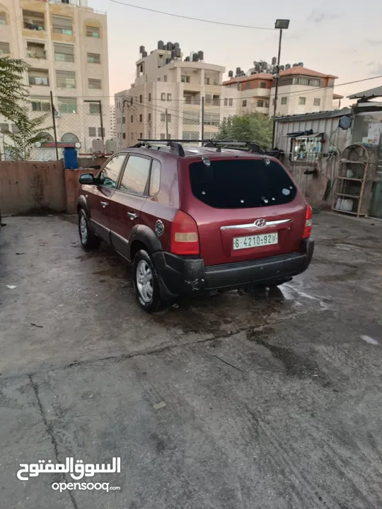 جيب هونداي توسان موديل 2007 ماطور 2000 لون خمري كام لا ينقصه شيئ