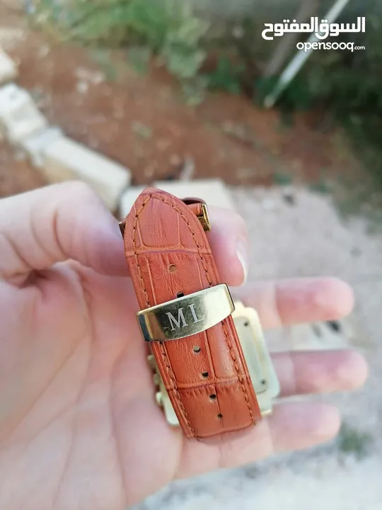 ساعة موناليز اصلية مطلية ذهب عليها احجار ألماس