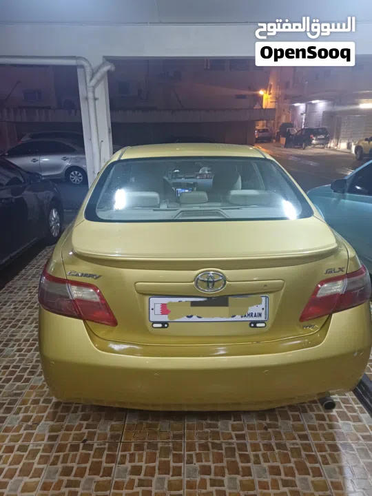 تويوتا كامري  2007  GLX  ذهبي تخشيبة وستارة خلفية  شاشة وكاميرا