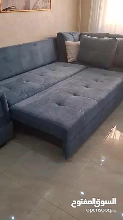 كنب زاويه حرف ل بلون تركواز انيق يتحول الى سرير كبير تصميم عملي وعصري بحاله شبه جديد للبيع بالمدينه