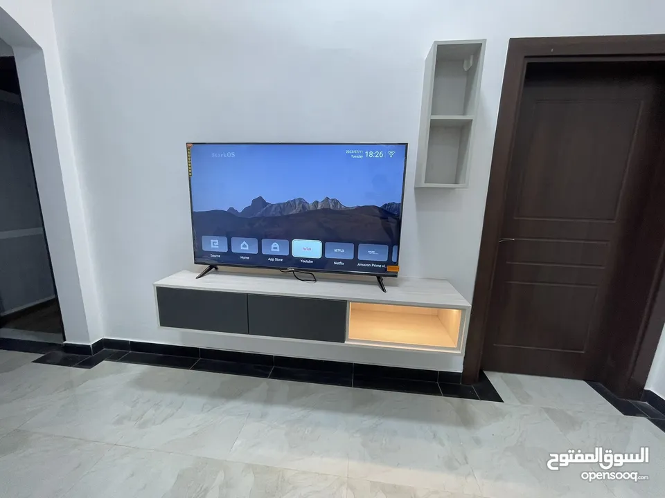 Tv 60 inch nikai +Tv unit customised