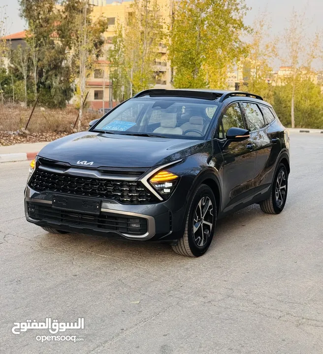 كيا سبورتاج هايبرد 2023 فل كامل مع بانوراما - باللون المميز والداخلية المميزة - والسعر المميز