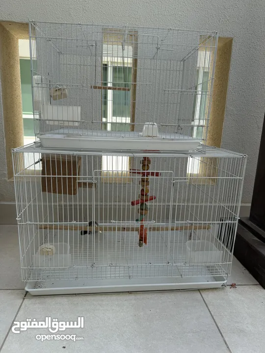 2 bird cages with swing and nest