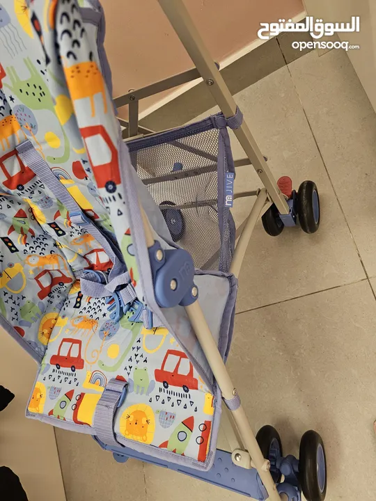 Foldable blue stroller with car print