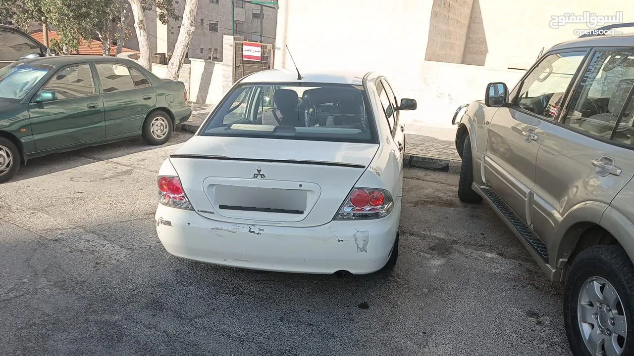 ميتسوبيشي لانسر للبيع بحاله ممتازه