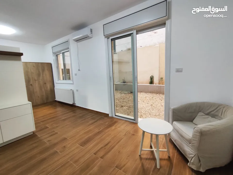 شقة جديدة مفروشة مع حديقة للإيجار – عين منجد  شارع إسكان المهندسين