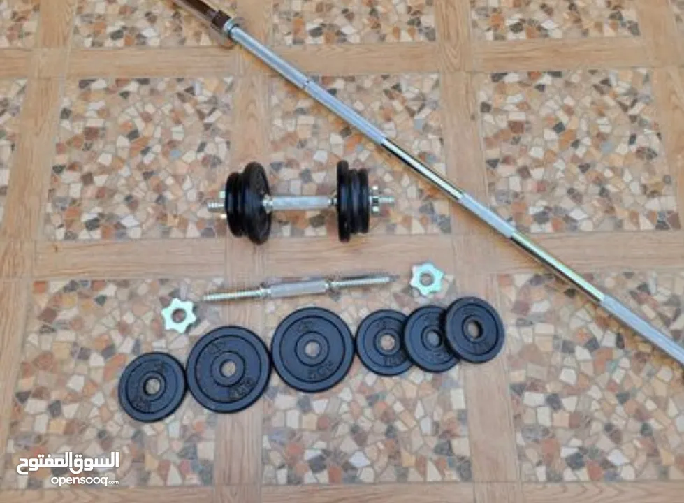 Olympic barbell and 2 dumbbells (10kg each)  بار حديد أولمبي (20 كجم) و2 دمبل (10 كجم لكل منهما)