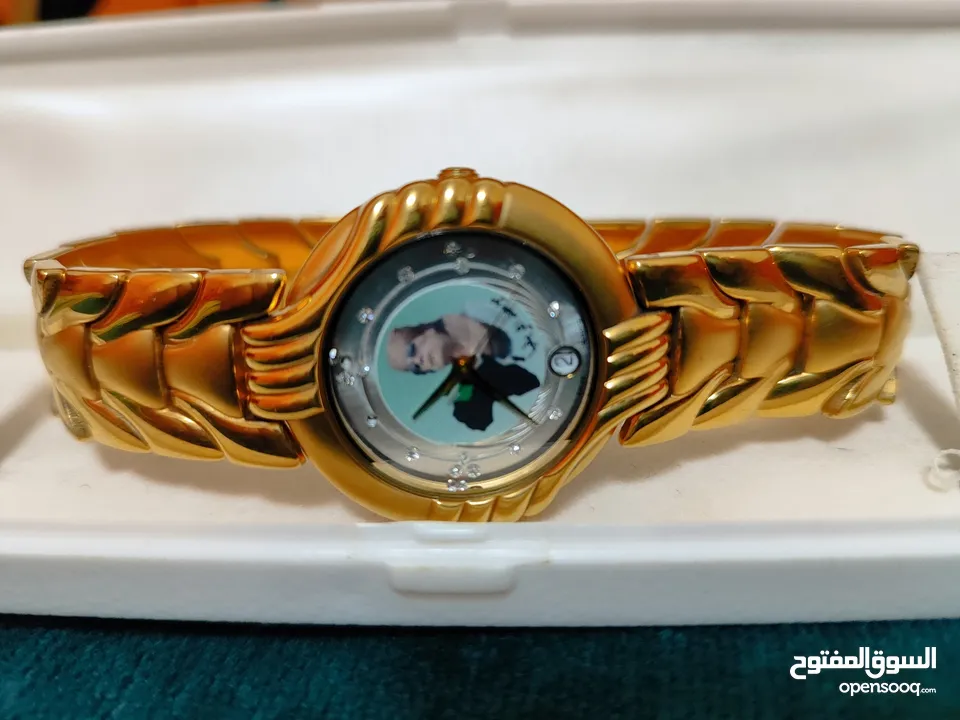 ساعة رجالية Swistar swiss Quartzسويسريةالصنع مطلية ذهب عيار 18عليها صورة العقيد القذافي