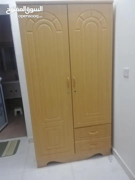 Cupboard and single bed with cot