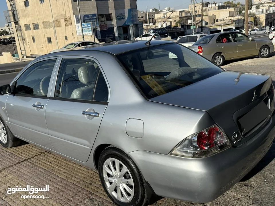 لانسر للبيع اقساط شخصي لون سلفر مميز 1.6 اصلي