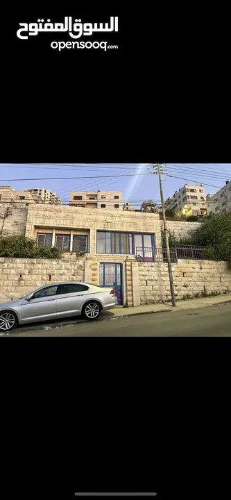 دونم ارض للبيع وعليه بناء في رفيديا مقابل جامعة النجاح