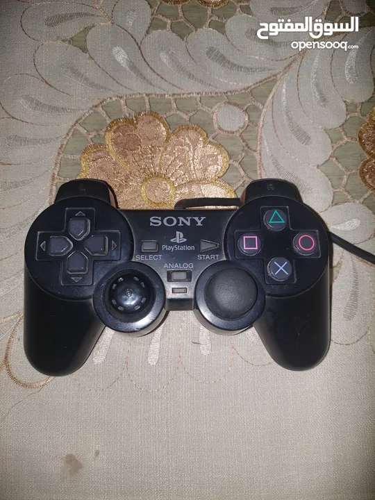 ps2 slim+2 original dualshock2+32 games+8 mb memory card