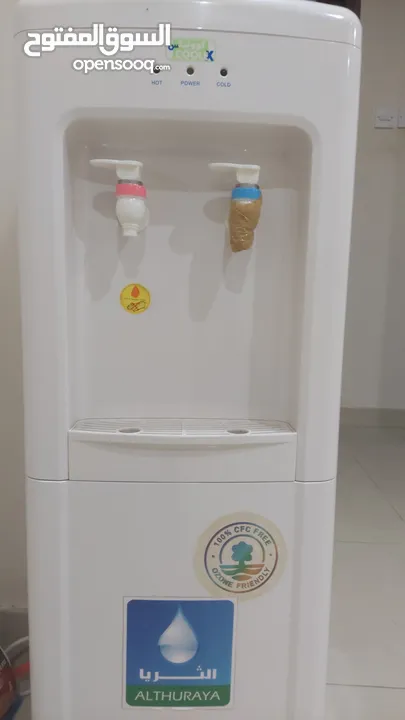water dispenser with 3 Oasis bottles