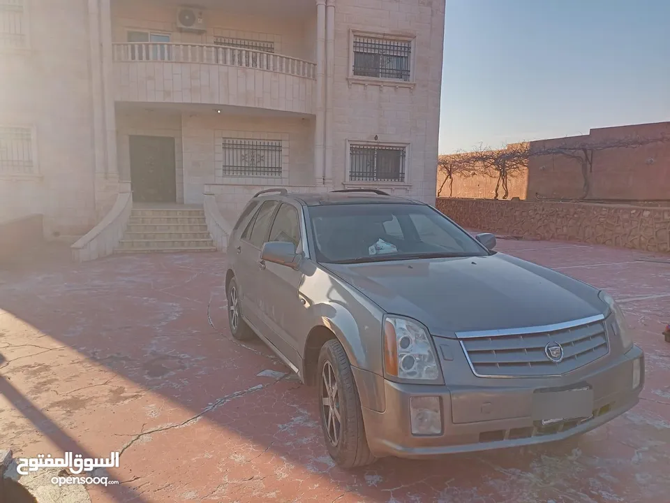 كاديلاك موديل 2004 بحالة الوكاله مرخصة لشهر 12 ماتور جديد بيان جمركي ما نزل ع رخصه لسه