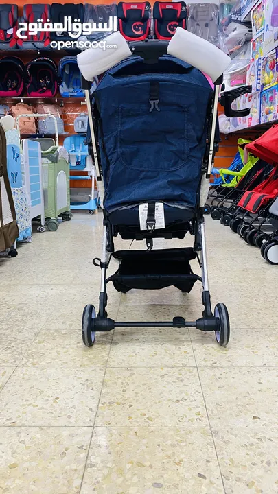 عرباية السفر من island toys ماركة NE الروسية  مع امكانية التحويل ل حقيبة يد للحمل