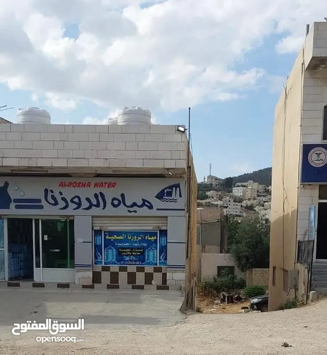 طابق ارضي تجاري ومحل بنفس المجمع للايجار