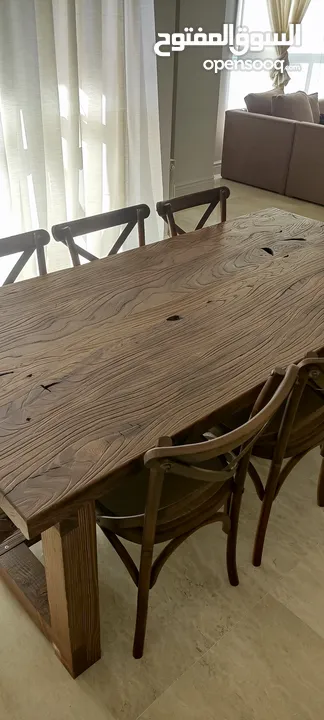 Dining table in rustic style made with elm wood.