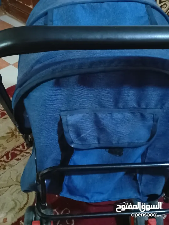 عرابة اطفال بحالة جيدة العجلات وشكل ومريحة للطفل