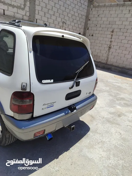كيا سبورتاج موديل 2000 لون ابيض ماتور 2000 توماتيك