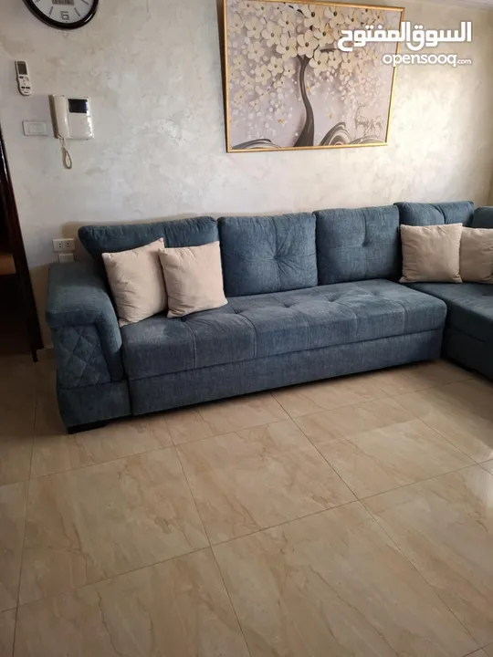 كنب زاويه حرف ل بلون تركواز انيق يتحول الى سرير كبير تصميم عملي وعصري بحاله شبه جديد للبيع بالمدينه