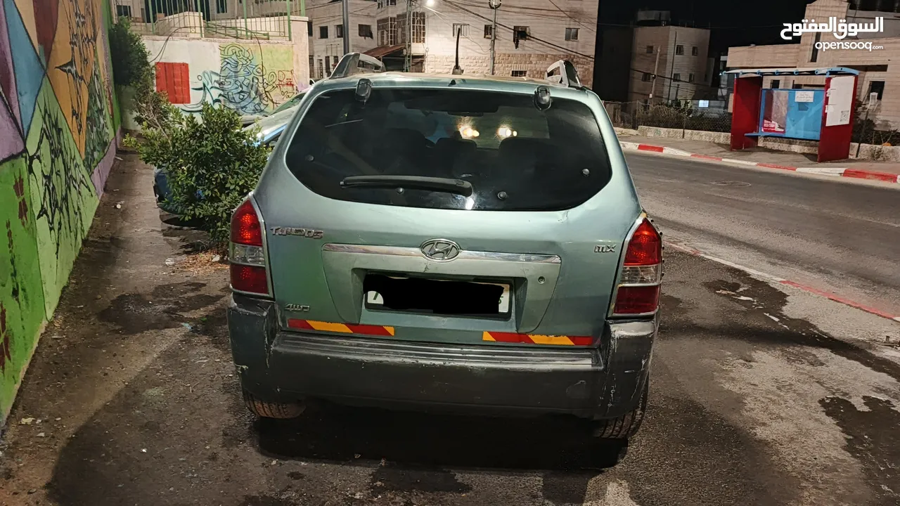 توسان 2005 عليه ترخيص من شهر 3/2025 الجيب بده ماتور 16صباب عمل صيانة طفيفه في الجناح الخلفي الايسر