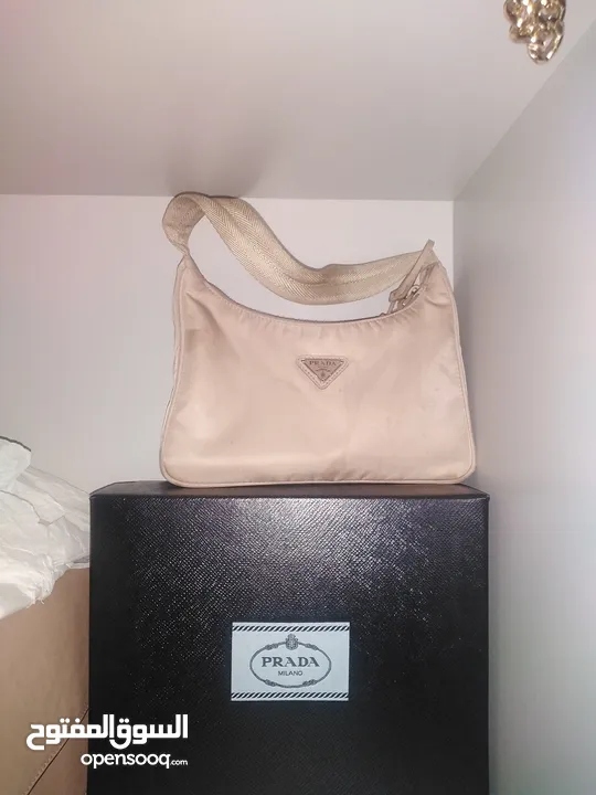 prada hand bag with box and dust bag original price was 512 bhd - Opensooq