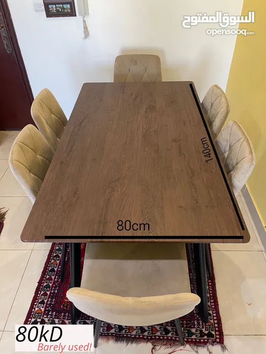 Brown dining table with beige chairs for 6 people
