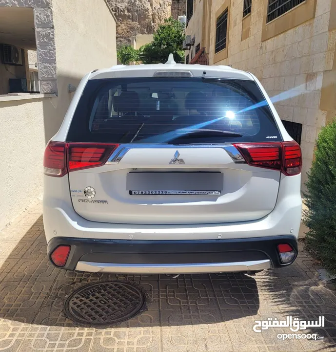 ميتسوبيشي أوتلاندر موديل 2018 (قابل للبدل) لون ابيض، دفع رباعي، فحص كامل ومرخصة حديثا لغاية 4/4/2026