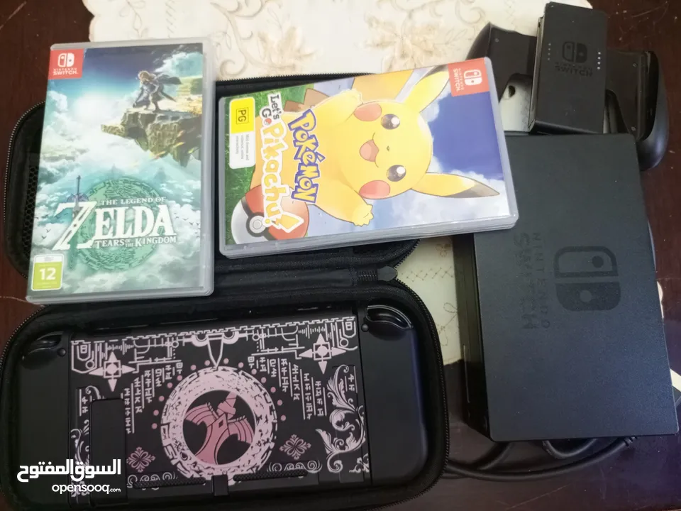 نينتندو سويتش OLED (مستعمل كالجديد) + لعبتين nintendo switch oled
