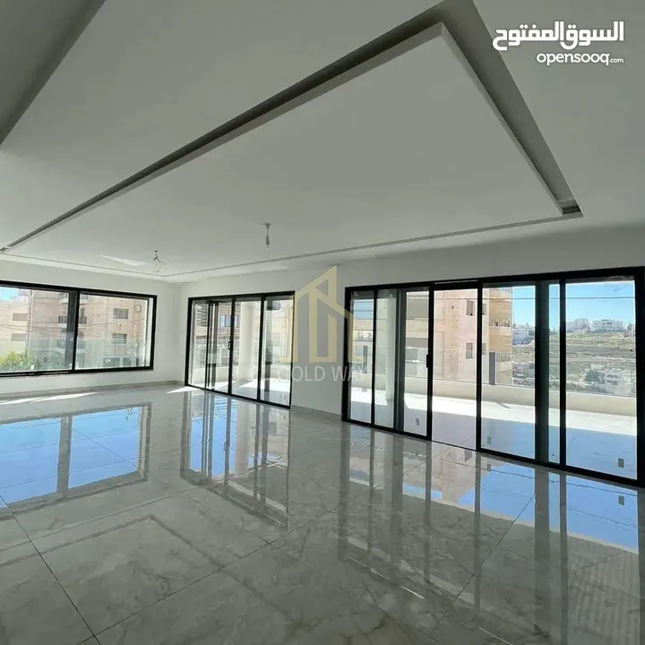 في أجمل مناطق طريق المطار خلف المدارس العالميه شقة أرضيه 290م بتشطيب راقي/ ref 9493