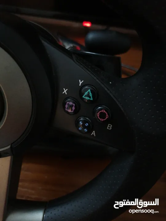 a pxn simulator pack with a steering wheel and a pedals with a gear shifter