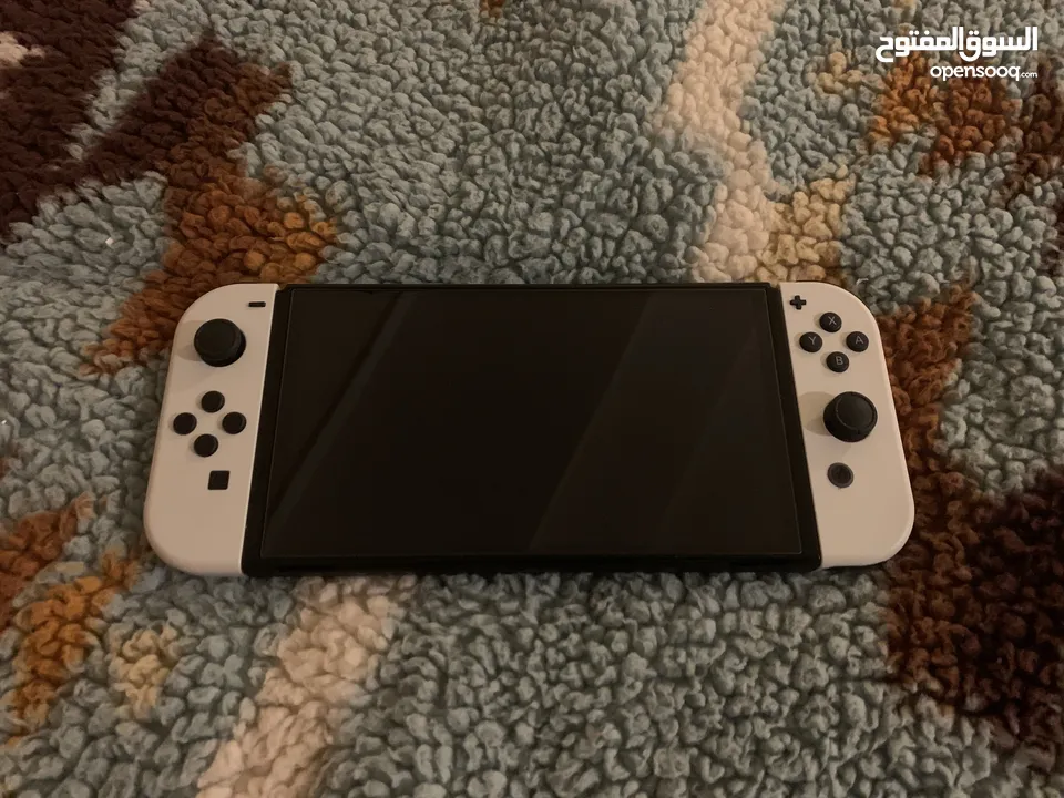 نينتيندو سويش oled مع العاب و جميع ملحقاتها  Nintendo switch oled with games and all accessories