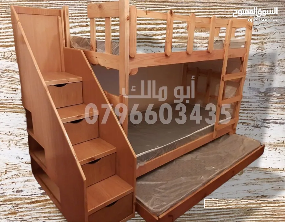 تخوت طابقين مع تخت اضافي من الأسفل مع درج وجوارير وارفف من وسط التخت سرير شبابي وأسرة سرير